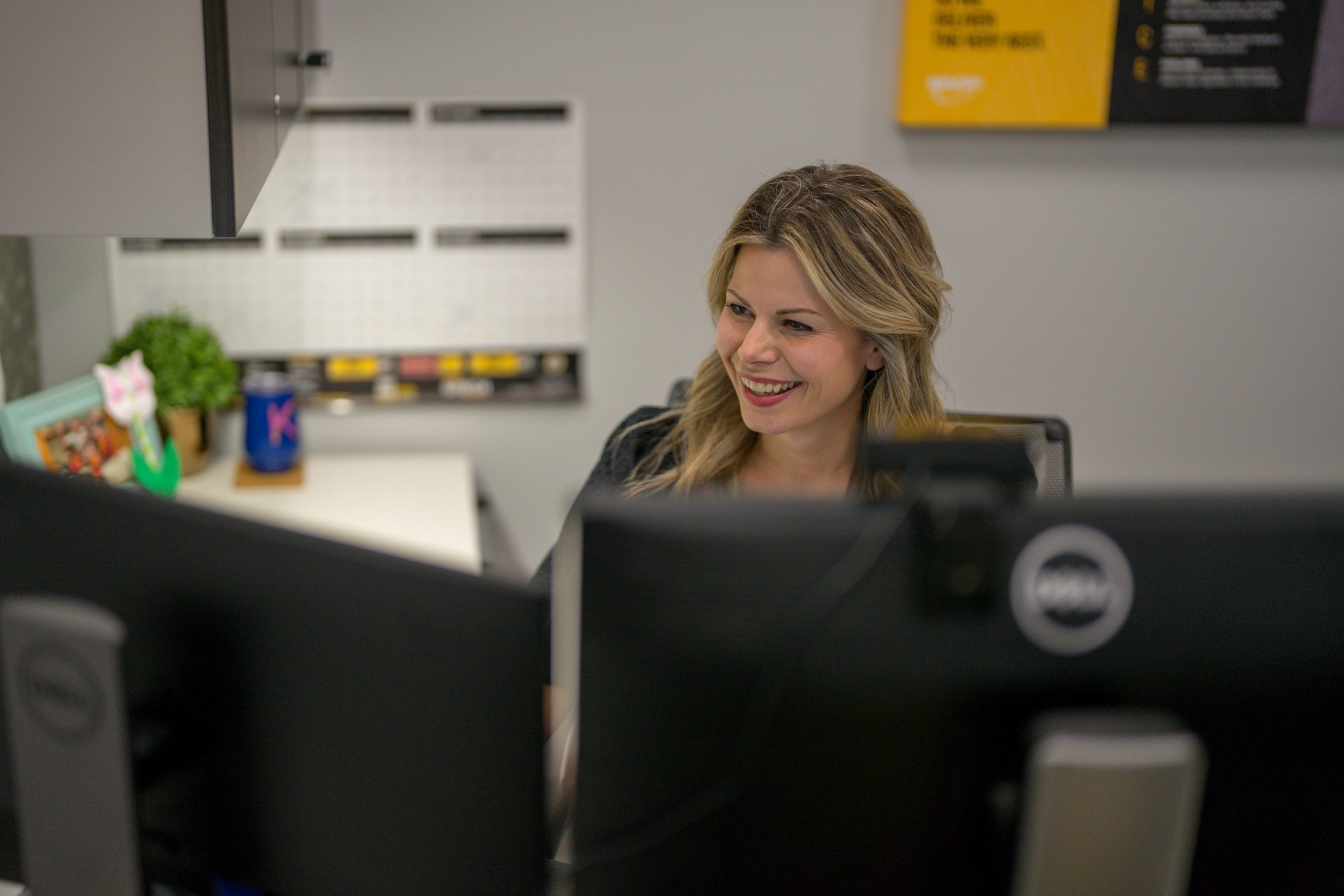 Female Management Trainee working at desk