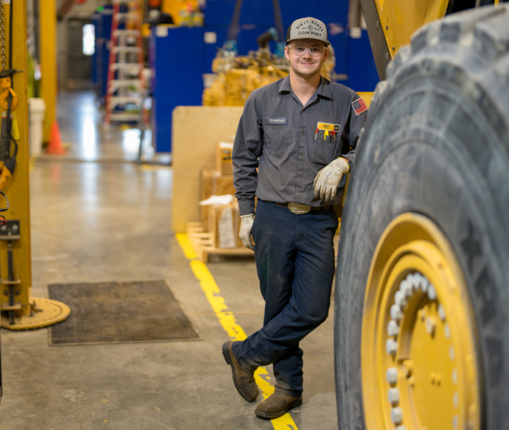 Intern Technician standing in service shop